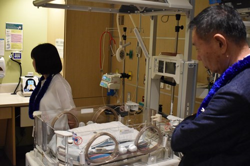 Aiwa Hospital clinicians and CEOs tour one of the rooms in Kapiolani's NICU.