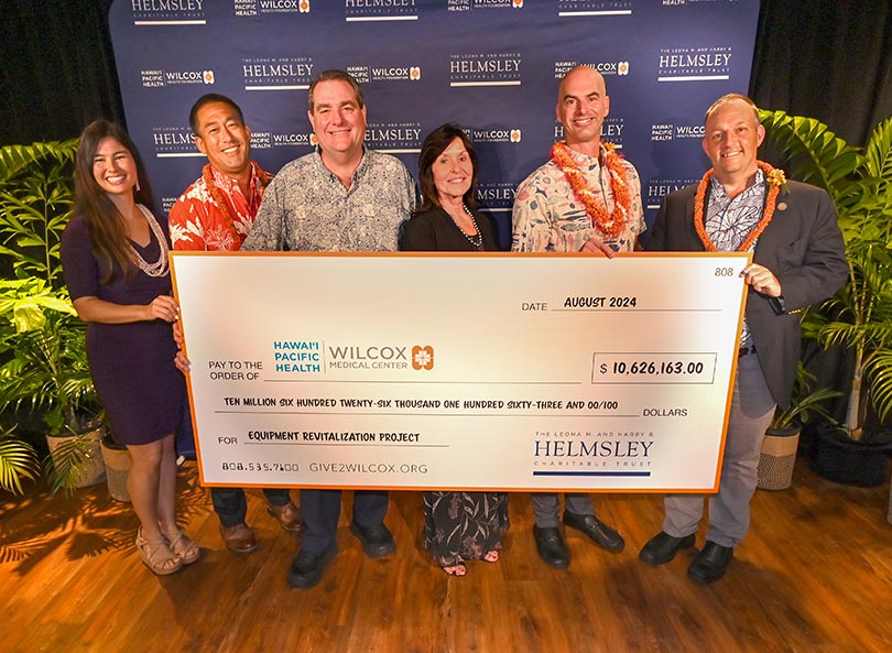 Group shot with giant check.