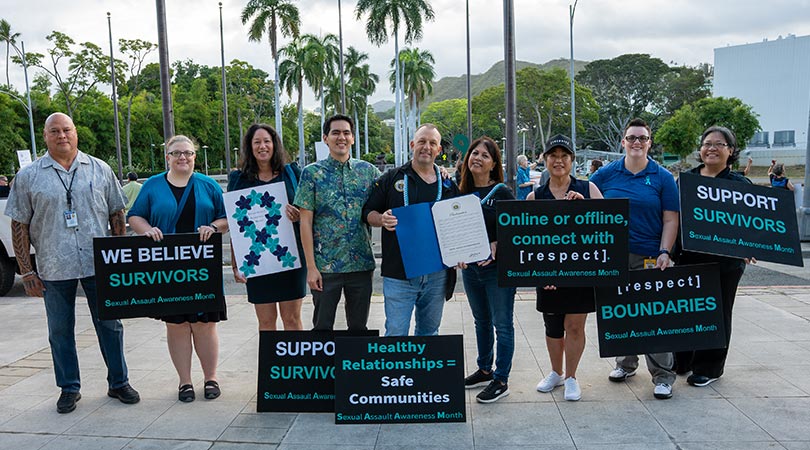 Small group of advocates of sexual assault awareness including Hawaii Governor Josh Green.