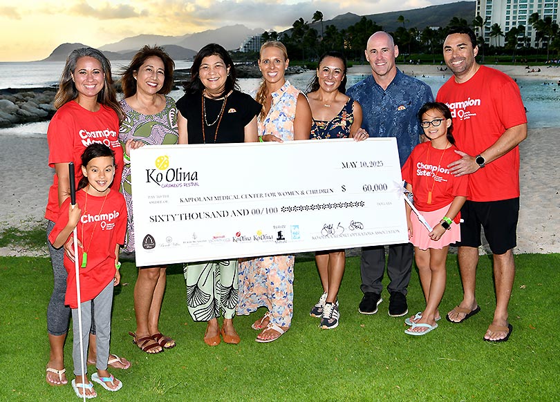 Group shot with giant check for $60,000.