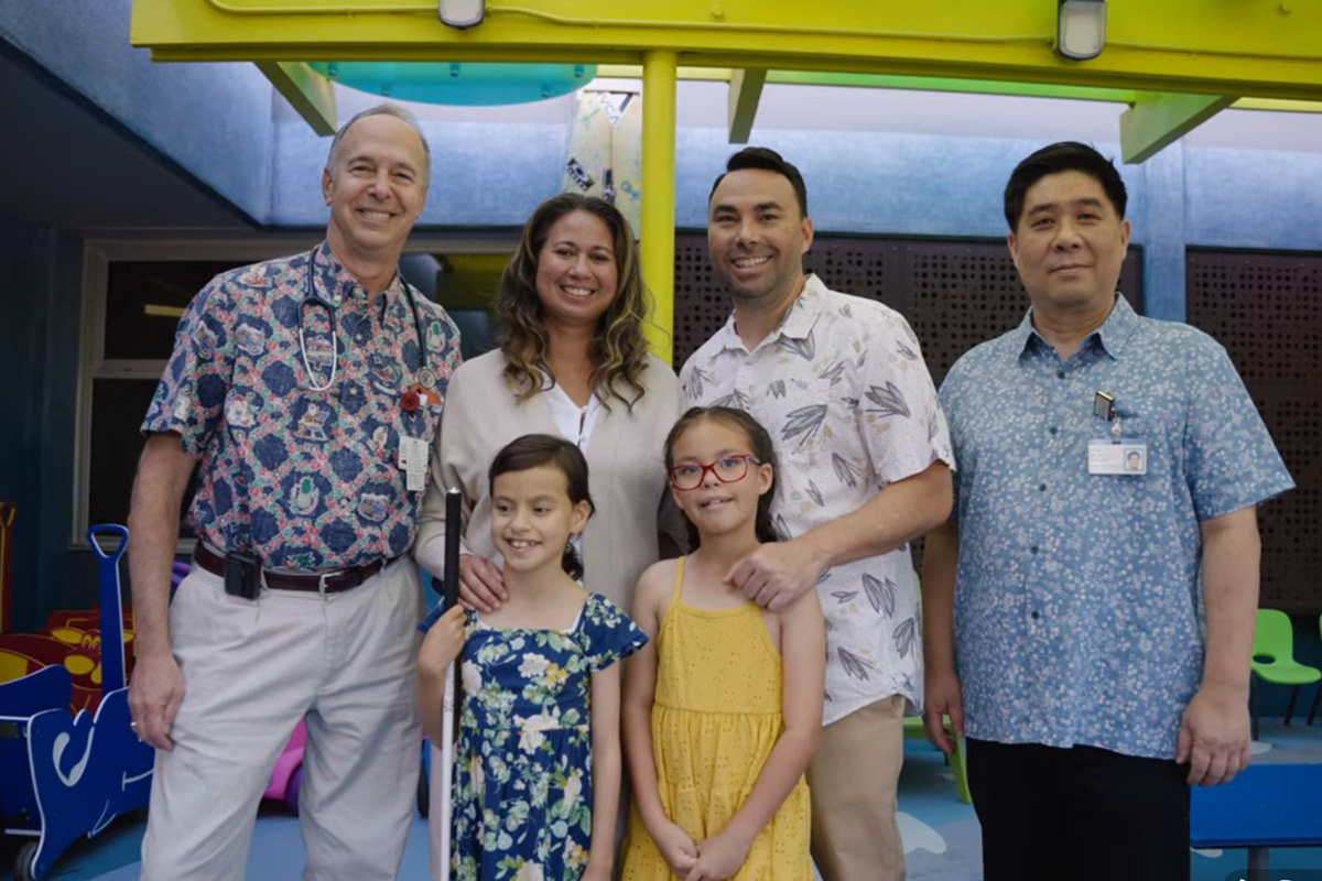Aurelia Awa (front left) with her family and physicians. From left: Dr. Darryl Glaser, Kapiolani pediatric hematologist/oncologist; Rachel, Quinn, and Kaimi Awa; and Dr. James Sim, Kapiolani pediatric cardiologist.