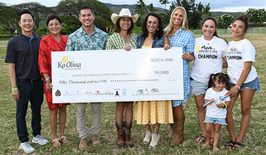 Group shot with giant check for $50,000.