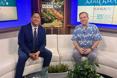 Dr. Timothy Swindoll with Hawaii News Now Sunrise anchor Steve Uyehara on the news set.