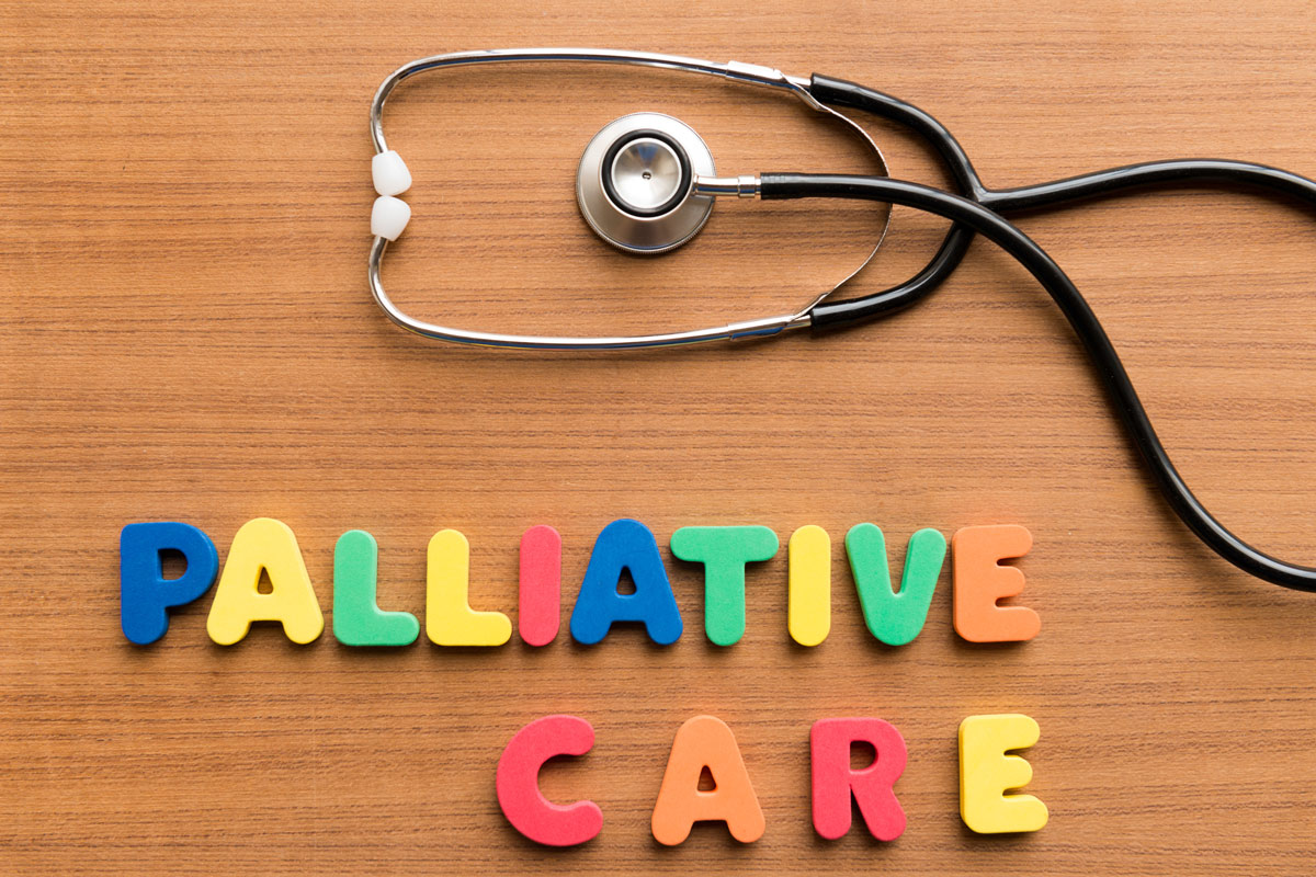 a stethascope with the words "palliative care" spelled out