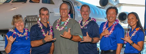 The Kapiolani Critical Care Transport Team flash a shaka at the dedication ceremony for the hospital's new air ambulance.