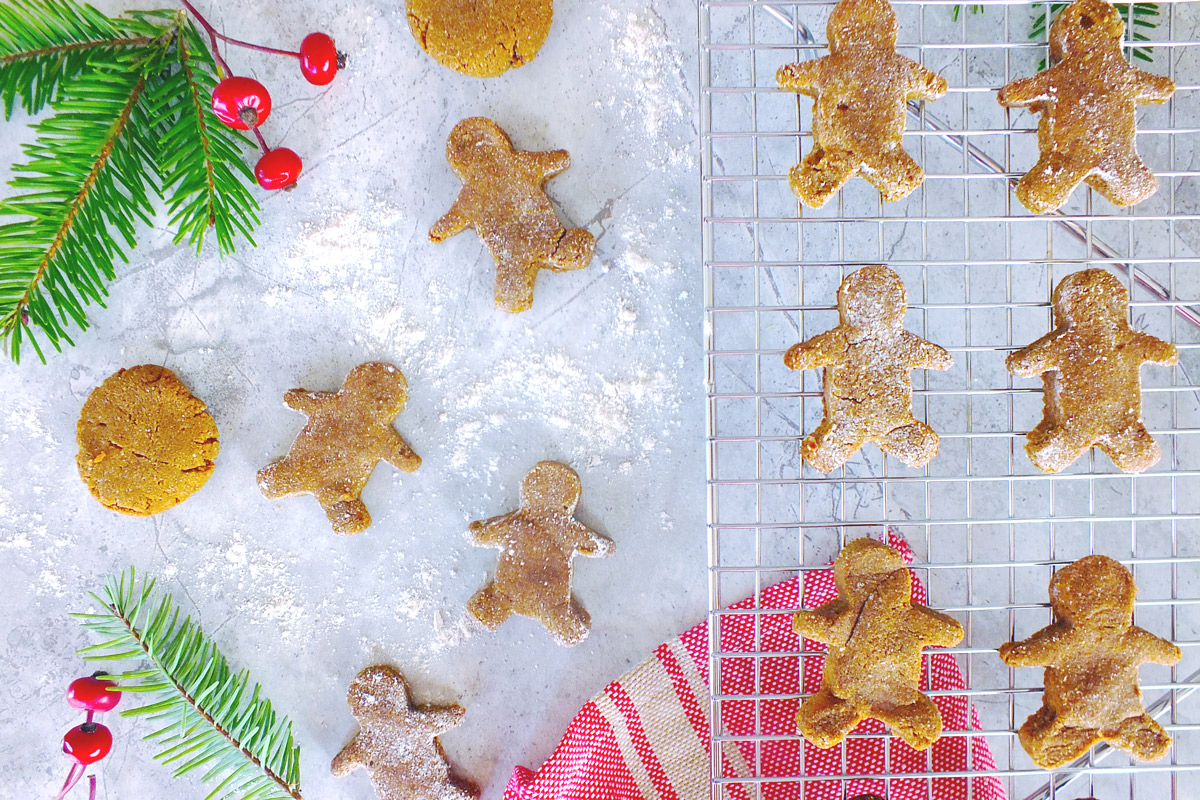 Gingerbread men on a table decorated for the holidays
